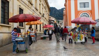 People and their small businesses on the street, Colombian fast food, Bogotá, La Candelaria district. 