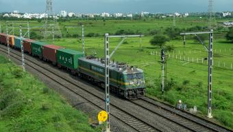 reight train hauled by a WAG9 electric locomotive at Vadgaon near Pune India.