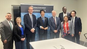Group photo of representatives from the World Bank Group’s Multilateral Investment Guarantee Agency (MIGA) and UK Export Finance (UKEF) following the signing of a memorandum of understanding in Washington, DC, to expand cooperation on mobilizing investment and supporting projects in developing countries.