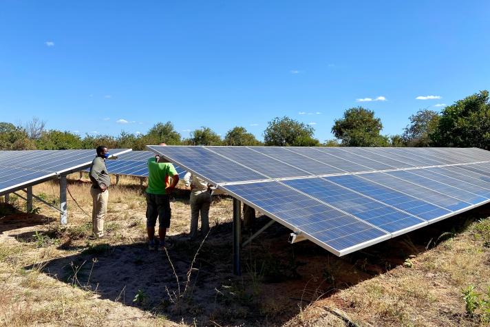 Tourists taking a tour of the solar panels at Asilia Jabali Ridge safari camp in Ruaha National Park, Tanzania